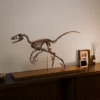 Bambiraptor skeleton 3D print displayed on a cabinet in a living room